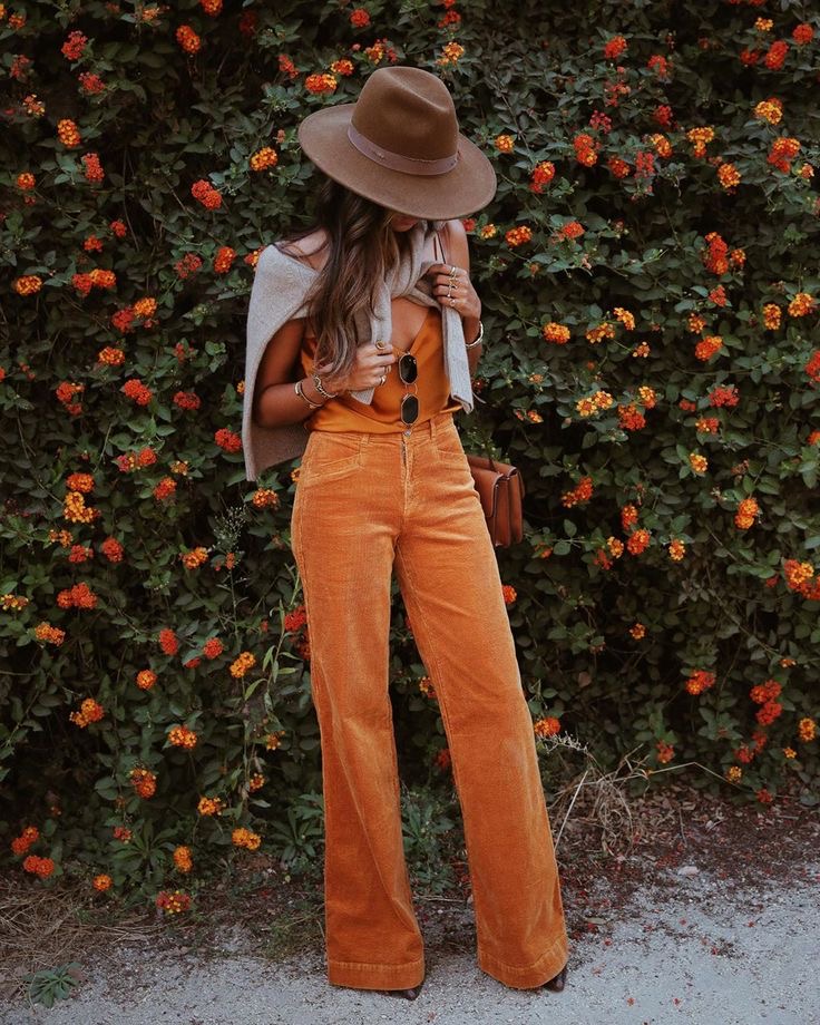 girl wearing a fedora in fall