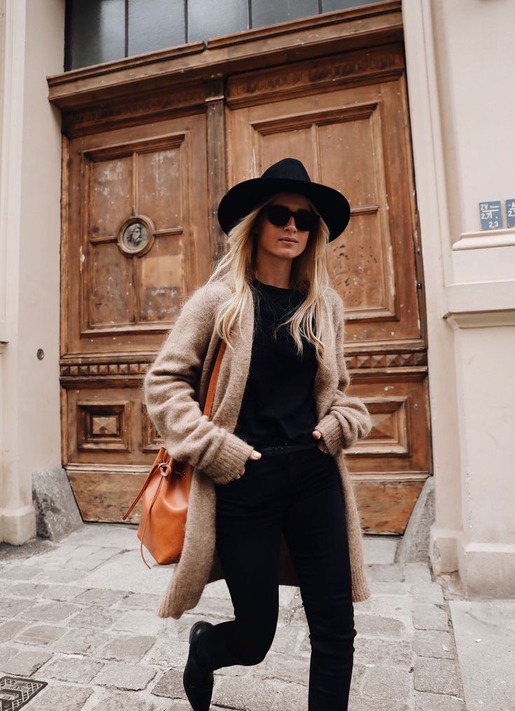 girl wearing a felt brimmed hat in fall