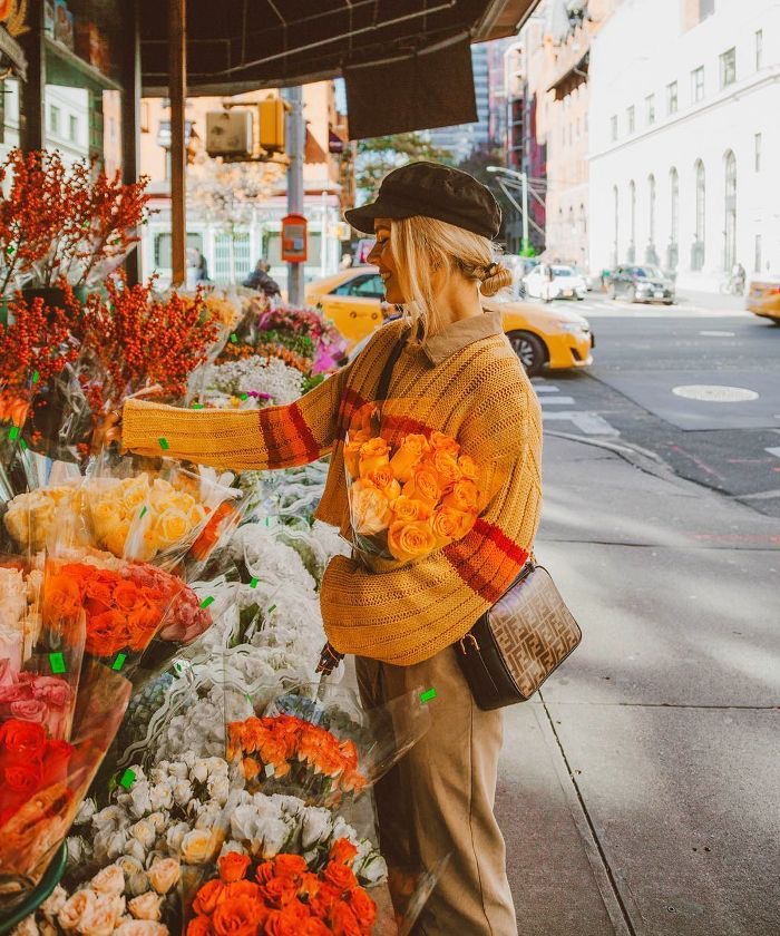 girl wearing a baker boy hat in fall