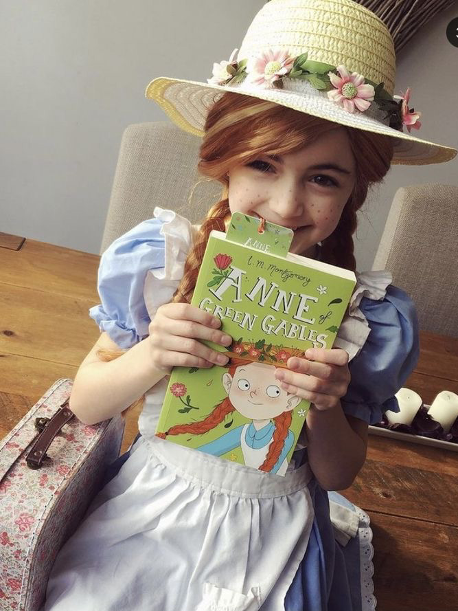 Child dressed as Anne of Green Gables from the book