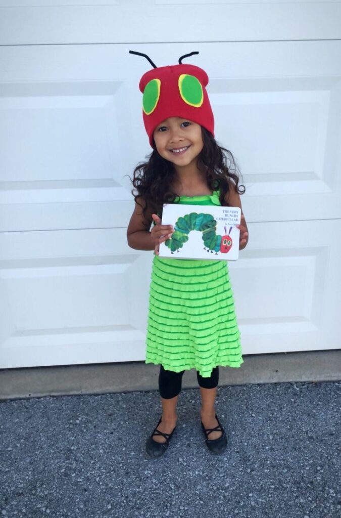 Child dressed as The Hungry Caterpillar from the book