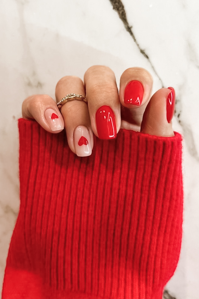 Neutral nail with tiny heart design for Valentine's Day