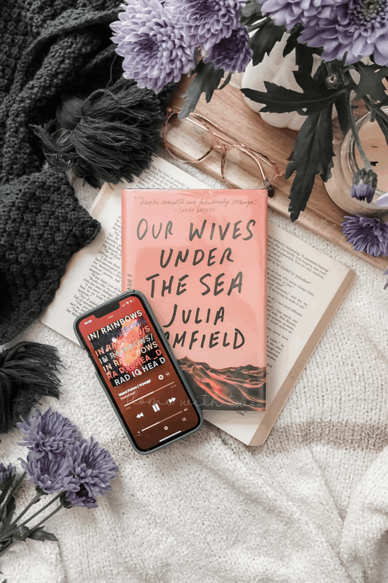 book photography of Our Wives Under The Sea with Weird Fishes by Radiohead playing