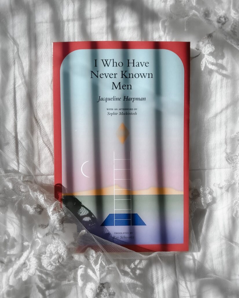 flatlay book photography of I Who Have Never Known Men Novel by Jacqueline Harpman