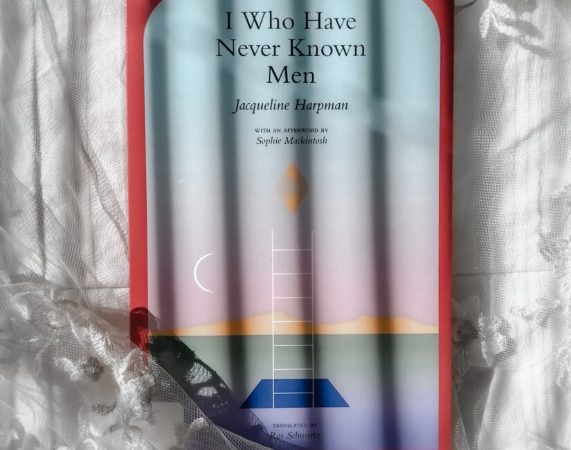 flatlay book photography of I Who Have Never Known Men Novel by Jacqueline Harpman