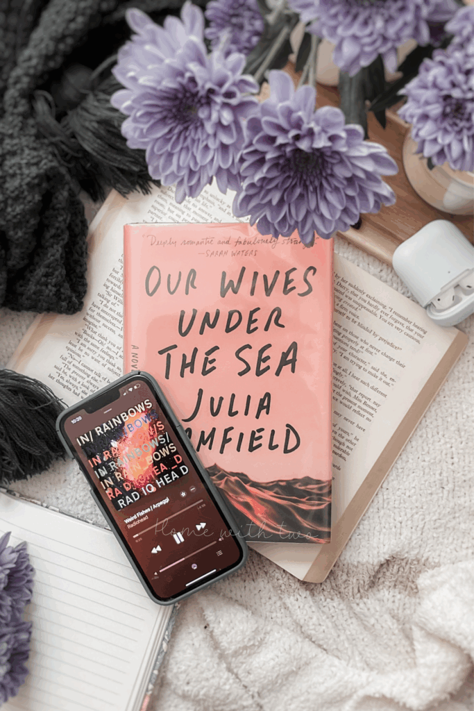 book photography of Our Wives Under The Sea with Weird Fishes by Radiohead playing